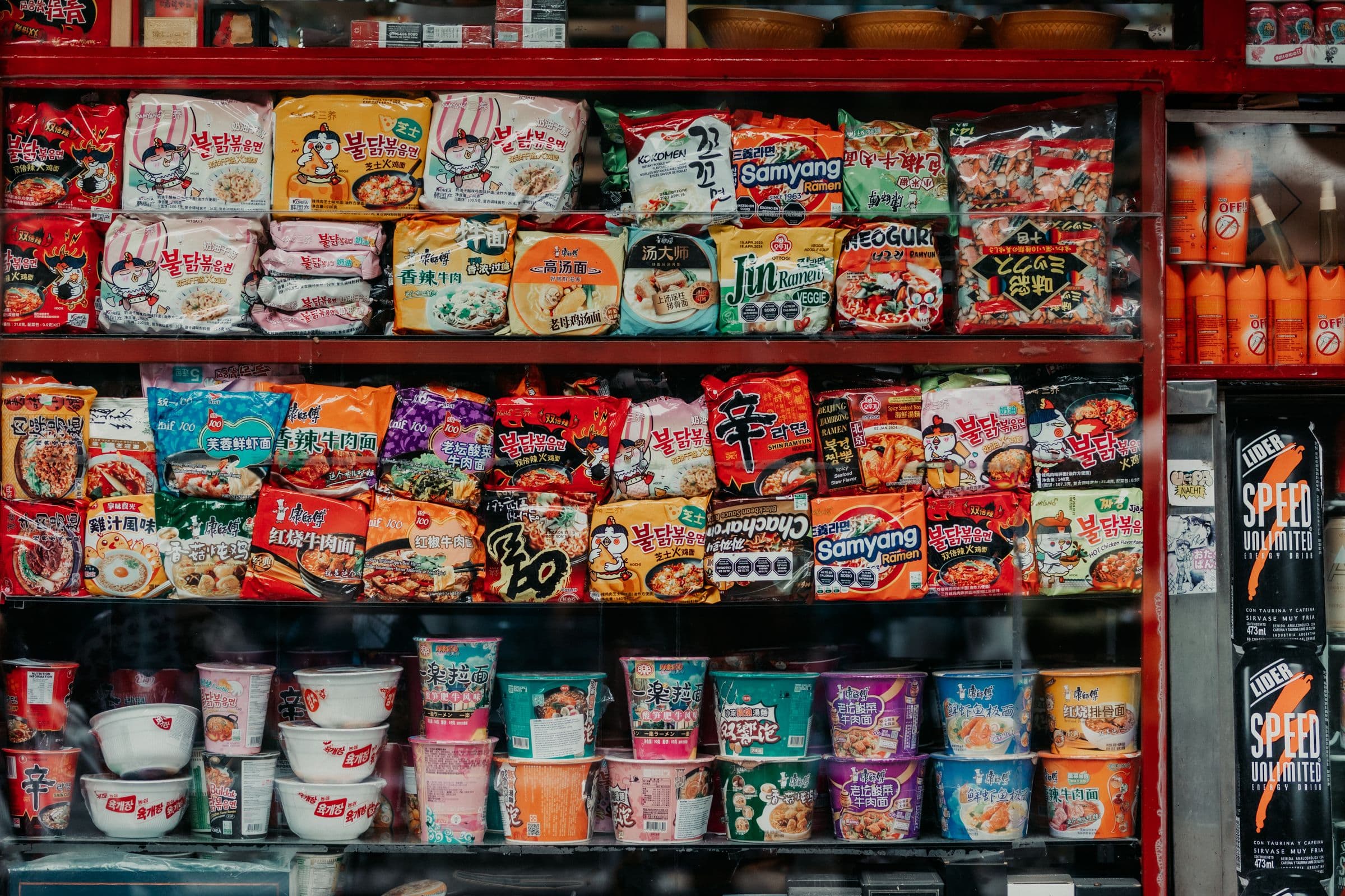 Packaged grocery food in printed cartons, pouches and sealed wrappers, stacked side by side