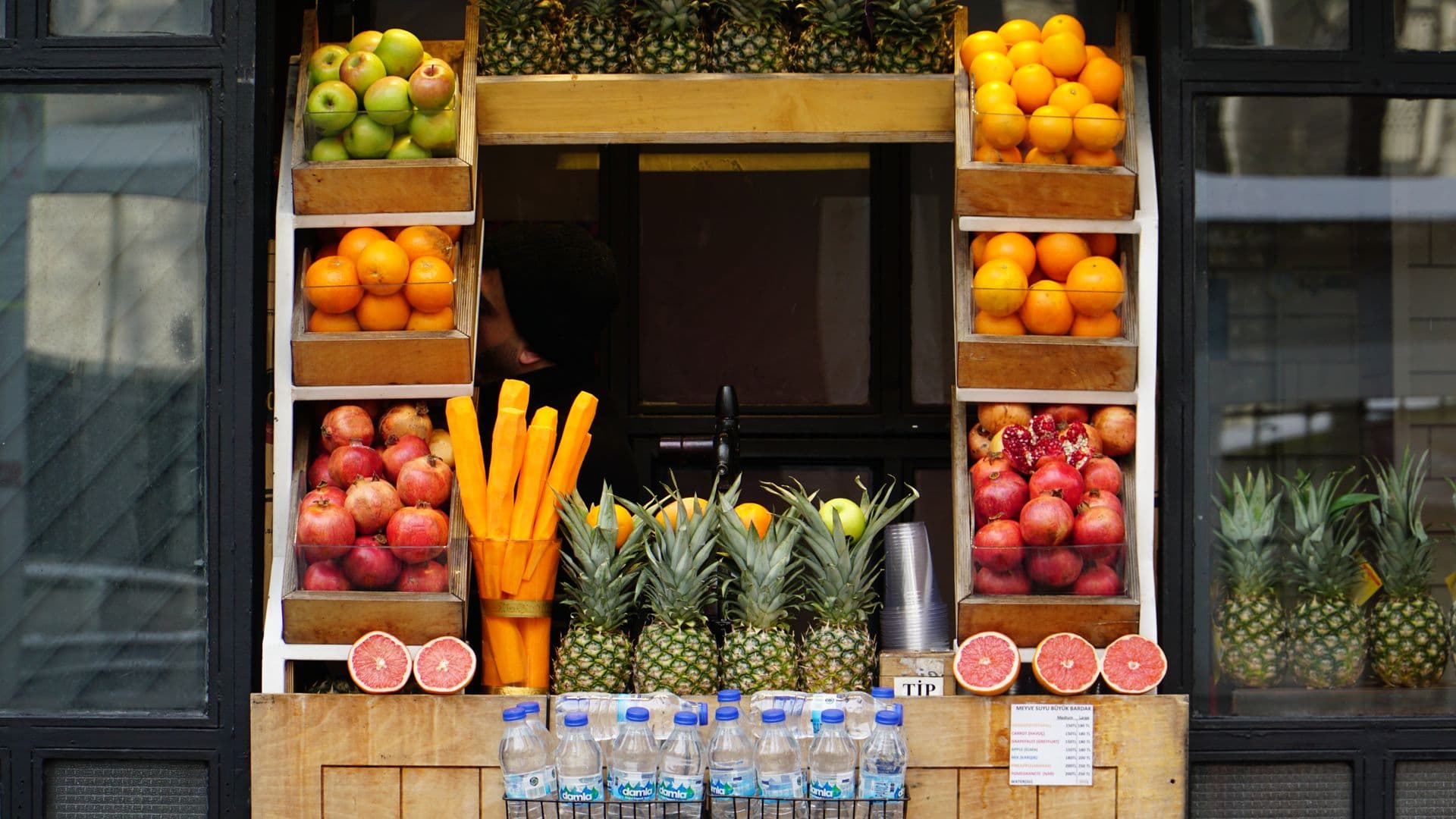 Vivid display of fresh fruits at a street vendor stall, perfect for food and travel imagery.